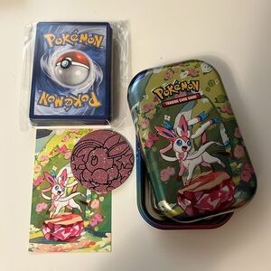 Pokemon Prismatic Evolution Tin Sylveon Design with 50 card bundle